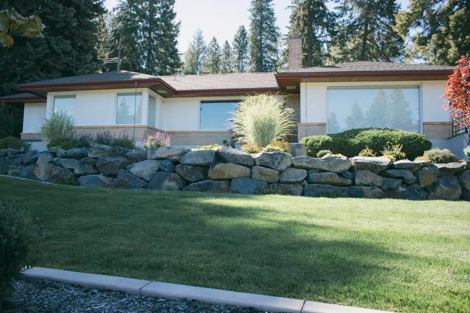 Tiered Boulder Retaining Wall with Lawn Integration