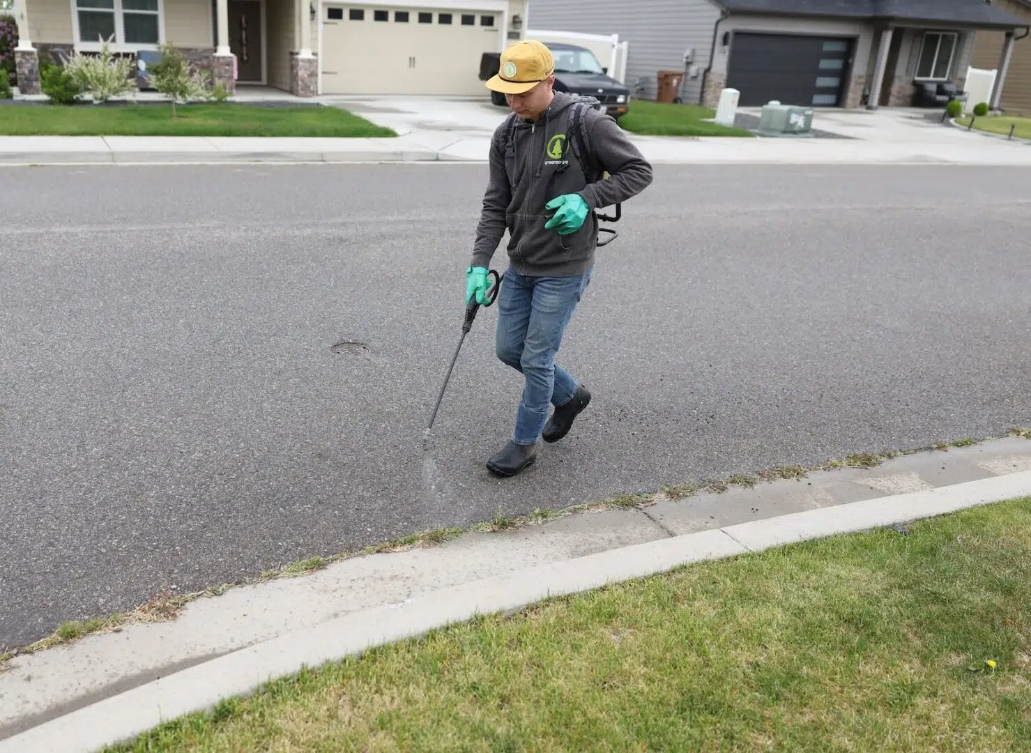 Greenscape tech spraying for weeds