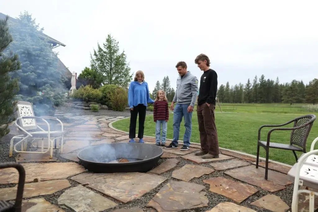 Jesse and his family around a firepit