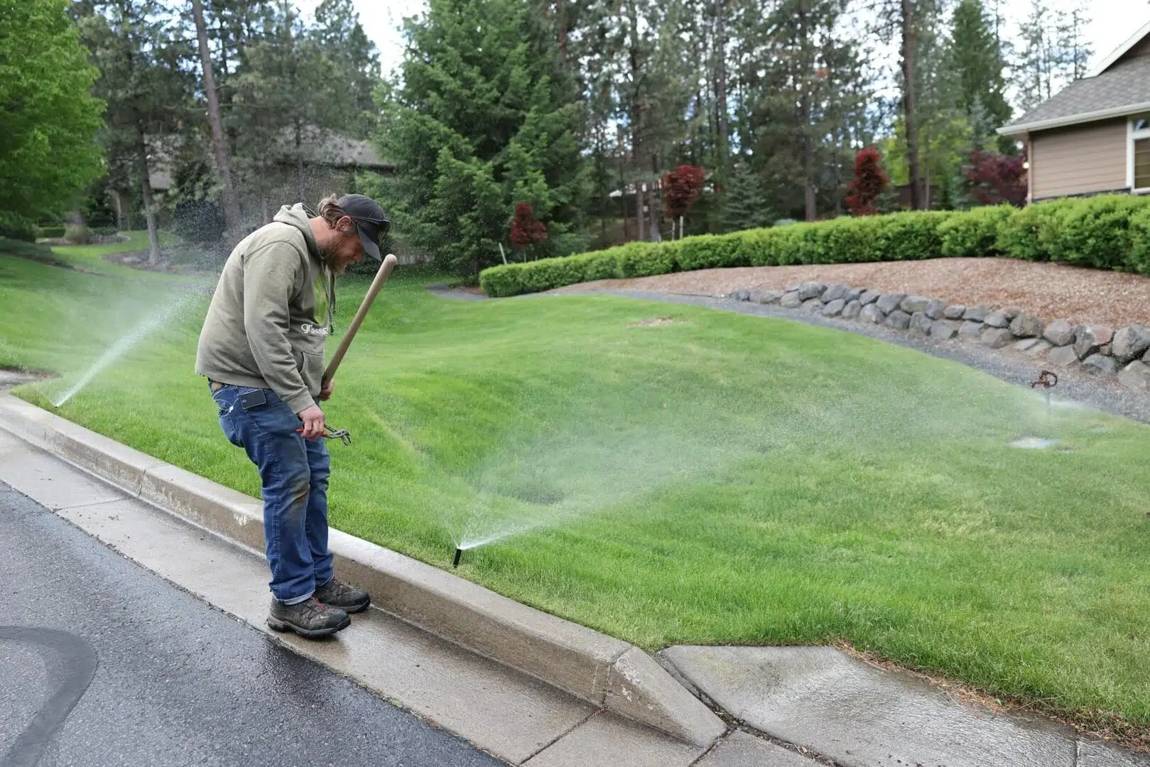 Sprinkler adjustment for proper lawn coverage