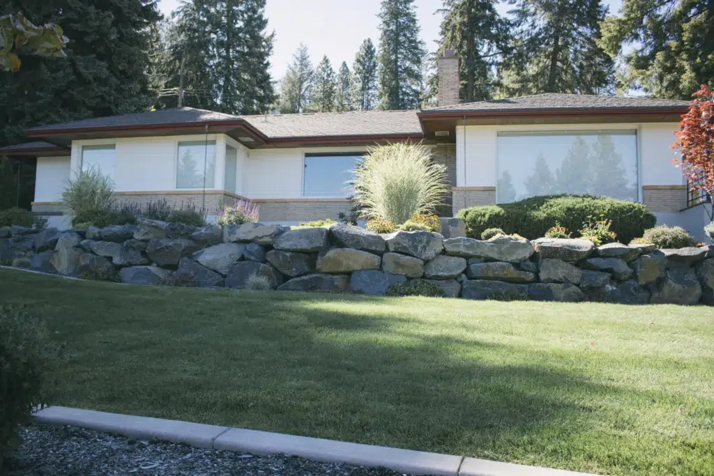 Tiered Boulder Retaining Wall with Lawn Integration
