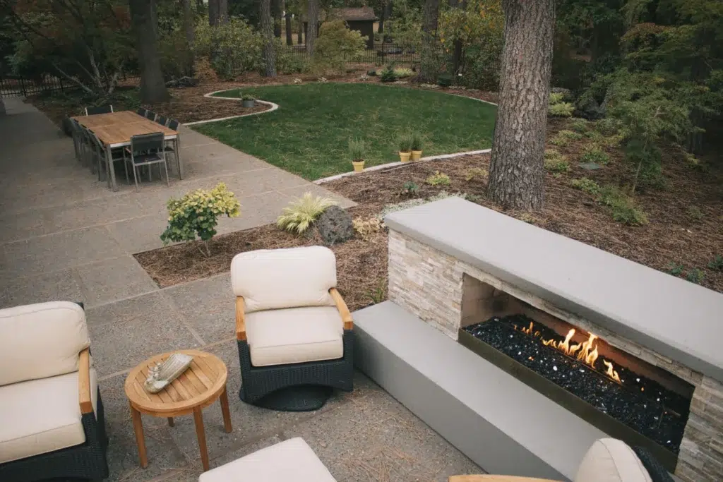 landscape design fire place seating area and greenspace