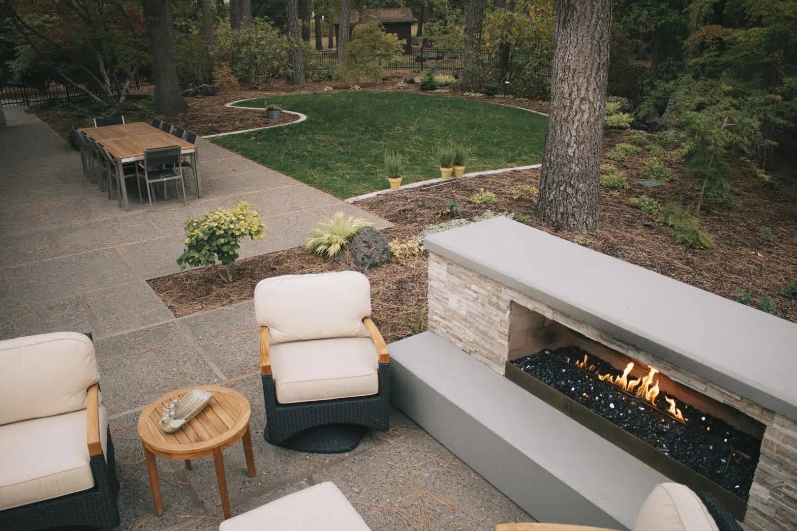 landscape design fire place seating area and greenspace